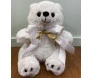 urso polar de pelucia com laço branco