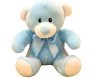 Urso de pelúcia azul com detalhes brancos e laço azul